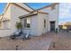Charming home featuring a welcoming entrance, gravel landscaping, and a cozy front patio seating area at 14 Parco Fiore Ct, Henderson, NV 89011