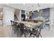Spacious open concept kitchen and dining area with stylish gray cabinetry and finishes at 14 Parco Fiore Ct, Henderson, NV 89011