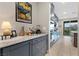 Kitchen extension with granite countertops, ample storage, and seamless access to the outdoor patio area with mountain views at 14 Parco Fiore Ct, Henderson, NV 89011