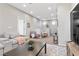 Open living space with plush seating, neutral decor, and abundant natural light upstairs at 14 Parco Fiore Ct, Henderson, NV 89011