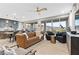 Bright, open living space featuring a neutral color palette and sliding doors with mountain views at 14 Parco Fiore Ct, Henderson, NV 89011