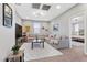 Spacious living area with a sectional sofa, TV, and adjacent bedroom view at 14 Parco Fiore Ct, Henderson, NV 89011