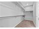 Spacious walk-in closet with shelving and carpeted flooring at 14 Parco Fiore Ct, Henderson, NV 89011