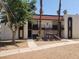 Exterior elevation of two-story unit with dark brown trim, stucco siding, and a tile roof at 1405 Vegas Valley Dr # 270, Las Vegas, NV 89169
