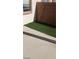 Low maintenance backyard featuring artificial turf and concrete patio for outdoor living at 1423 Orange Jubilee Rd, Henderson, NV 89014