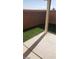 Backyard featuring low-maintenance artificial turf and a concrete patio area at 1423 Orange Jubilee Rd, Henderson, NV 89014