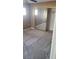 This bedroom features neutral walls, carpet flooring, and sliding closet doors at 1423 Orange Jubilee Rd, Henderson, NV 89014