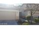 Charming home featuring a desert-landscaped front yard and two-car garage at 1423 Orange Jubilee Rd, Henderson, NV 89014
