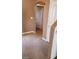 Hallway with neutral carpet and arched doorway leading to bedroom at 1423 Orange Jubilee Rd, Henderson, NV 89014