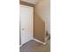 Hallway with stairs and a white door at 1423 Orange Jubilee Rd, Henderson, NV 89014