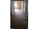 Upstairs hallway with neutral carpet and multiple doorways at 1423 Orange Jubilee Rd, Henderson, NV 89014