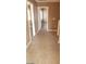 Upstairs hallway with neutral carpet and multiple doorways at 1423 Orange Jubilee Rd, Henderson, NV 89014