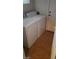 Laundry room with washer, dryer, and tiled flooring at 1423 Orange Jubilee Rd, Henderson, NV 89014