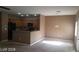 Spacious living area connected to a well-lit kitchen, perfect for gatherings at 1423 Orange Jubilee Rd, Henderson, NV 89014