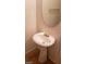 Bathroom featuring a pedestal sink and round mirror at 1423 Orange Jubilee Rd, Henderson, NV 89014