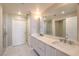 Bright bathroom featuring double sinks, large mirror, and walk in shower at 150 Las Vegas Blvd # 1912, Las Vegas, NV 89101