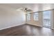 Modern bedroom featuring hardwood floors, ceiling fan, and abundant natural light from large windows at 150 Las Vegas Blvd # 1912, Las Vegas, NV 89101