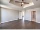 Contemporary bedroom with dark wood floors, ceiling fan, and easy access to multiple rooms at 150 Las Vegas Blvd # 1912, Las Vegas, NV 89101