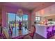 Chic dining room with city view and luxurious chandelier, connected to a modern kitchen with breakfast bar at 150 Las Vegas Blvd # 1912, Las Vegas, NV 89101