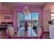 Modern dining area with beautiful city views, an elegant chandelier, hardwood floors, and connections to living areas at 150 Las Vegas Blvd # 1912, Las Vegas, NV 89101