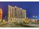 Stunning night view of a high-rise building with illuminated parking garage at 150 Las Vegas Blvd # 1912, Las Vegas, NV 89101