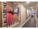 Hallway view with hardwood floors and art leading to a bright, modern office space with city views at 150 Las Vegas Blvd # 1912, Las Vegas, NV 89101