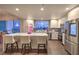 Bright, modern kitchen featuring stainless steel appliances, sleek white cabinetry, quartz countertops, and a breakfast bar at 150 Las Vegas Blvd # 1912, Las Vegas, NV 89101