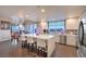 Open kitchen and dining area with a view; features modern appliances, island seating, and a decorative chandelier at 150 Las Vegas Blvd # 1912, Las Vegas, NV 89101