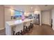 Bright kitchen with stainless steel appliances, light wood cabinets, quartz countertops and seating at the island at 150 Las Vegas Blvd # 1912, Las Vegas, NV 89101