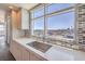 Kitchen sink with stainless steel faucet, tile backsplash, expansive window and stunning city views at 150 Las Vegas Blvd # 1912, Las Vegas, NV 89101