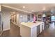 Spacious open layout kitchen features a wine cooler, modern island with seating, and leads to the dining area at 150 Las Vegas Blvd # 1912, Las Vegas, NV 89101