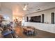 Open-concept living room with hardwood floors, comfortable furniture, an entertainment center, and a dining area beyond at 150 Las Vegas Blvd # 1912, Las Vegas, NV 89101