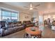 Bright living room with hardwood floors, city views, a leather couch, and an open layout connecting to the dining area at 150 Las Vegas Blvd # 1912, Las Vegas, NV 89101