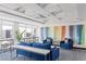 Inviting living room features stylish blue seating, modern decor, and city views through large windows at 150 Las Vegas Blvd # 1912, Las Vegas, NV 89101