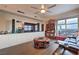 Spacious living room featuring hardwood floors, a entertainment center, city views, and a comfortable leather couch at 150 Las Vegas Blvd # 1912, Las Vegas, NV 89101