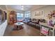 Bright living room featuring hardwood floors, a comfortable brown leather couch, and expansive windows with mountain views at 150 Las Vegas Blvd # 1912, Las Vegas, NV 89101