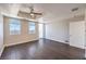 Bright living room with two windows, hardwood floors, and access to the balcony at 150 Las Vegas Blvd # 1912, Las Vegas, NV 89101