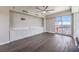 Living room with built-in cabinets, hardwood floors, and city views at 150 Las Vegas Blvd # 1912, Las Vegas, NV 89101