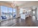Bright living room with a chandelier, balcony access, and a view of the city at 150 Las Vegas Blvd # 1912, Las Vegas, NV 89101