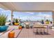 Inviting rooftop patio with shaded seating, colorful planters, and panoramic city views creates an ideal outdoor living space at 150 Las Vegas Blvd # 1912, Las Vegas, NV 89101
