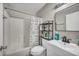 Cozy bathroom with white tiled shower and tub combination and modern vanity at 1714 Ringe Ln, Las Vegas, NV 89156