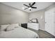 Cozy bedroom with wood-look floors, ceiling fan, neutral colors, and closet at 1714 Ringe Ln, Las Vegas, NV 89156