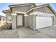 Charming single-story home featuring a two-car garage and desert landscaping at 1714 Ringe Ln, Las Vegas, NV 89156