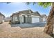Cozy single-story house featuring desert landscaping, a welcoming front entrance and a two-car garage at 1714 Ringe Ln, Las Vegas, NV 89156