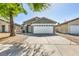 Attractive single-story residence showcasing a neat front yard, long drive way and attached garage at 1714 Ringe Ln, Las Vegas, NV 89156