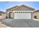 Inviting single-story home with a well-maintained front yard and attached two-car garage at 1714 Ringe Ln, Las Vegas, NV 89156
