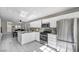 Modern kitchen featuring white cabinets, stainless steel appliances, and a breakfast bar at 1714 Ringe Ln, Las Vegas, NV 89156