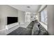 Living room features a large sectional sofa, tv, and great natural light at 1714 Ringe Ln, Las Vegas, NV 89156