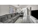 Living room flows into the dining room and features a large sectional sofa at 1714 Ringe Ln, Las Vegas, NV 89156