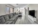Living room flows into the dining room and features a large sectional sofa at 1714 Ringe Ln, Las Vegas, NV 89156